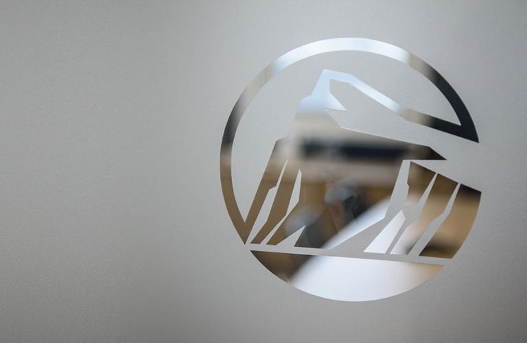 Image of Rock logo etched in glass.