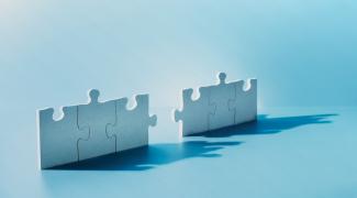 Jigsaw puzzle pieces standing on end
