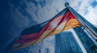 Germany national flag and government building with skyscrapers.
