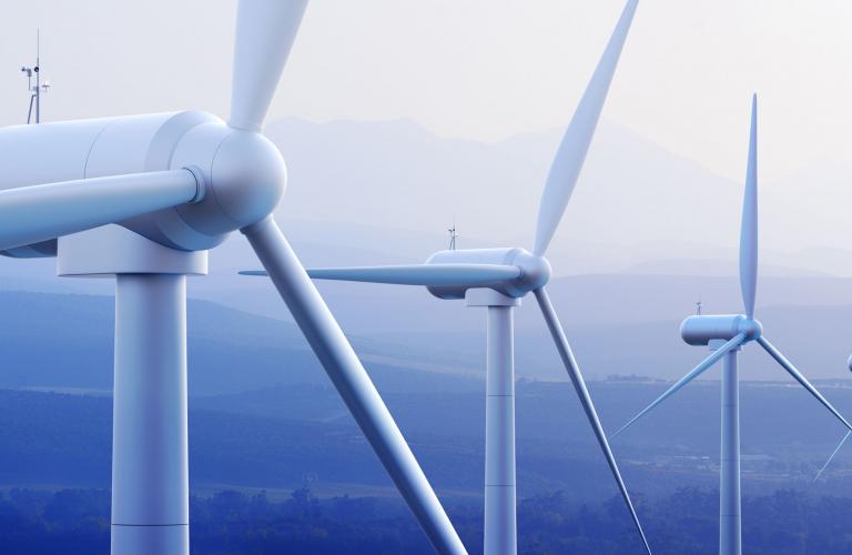 Turbines with distant mountains